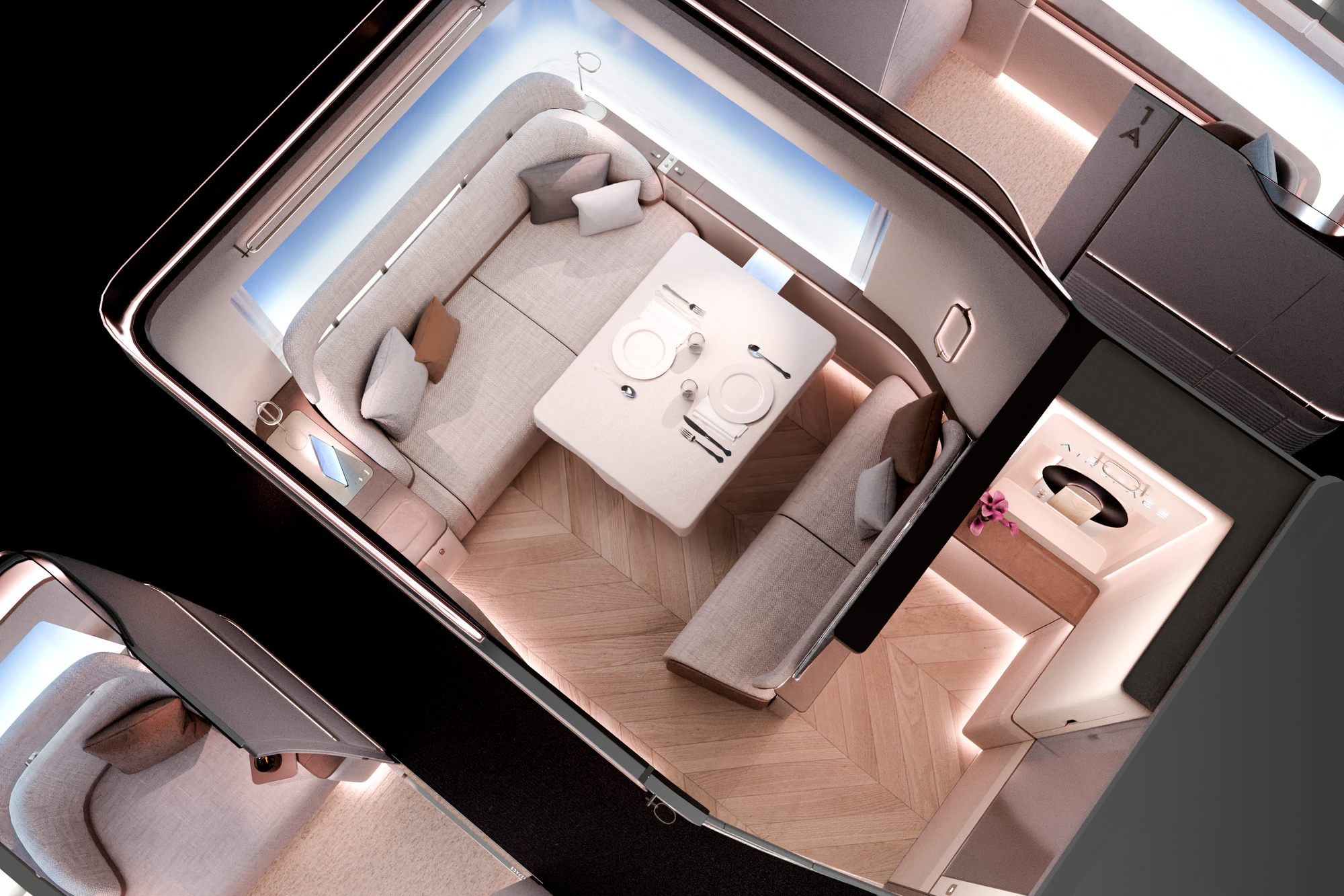 Rendering, first class suite, looking down from above. A large beige sofa faces a smaller darker beige loveseat over a big table. The floor is herringbone marquetry, and there is a powder area, cupboard and what looks like a door to a lavatory right in front.