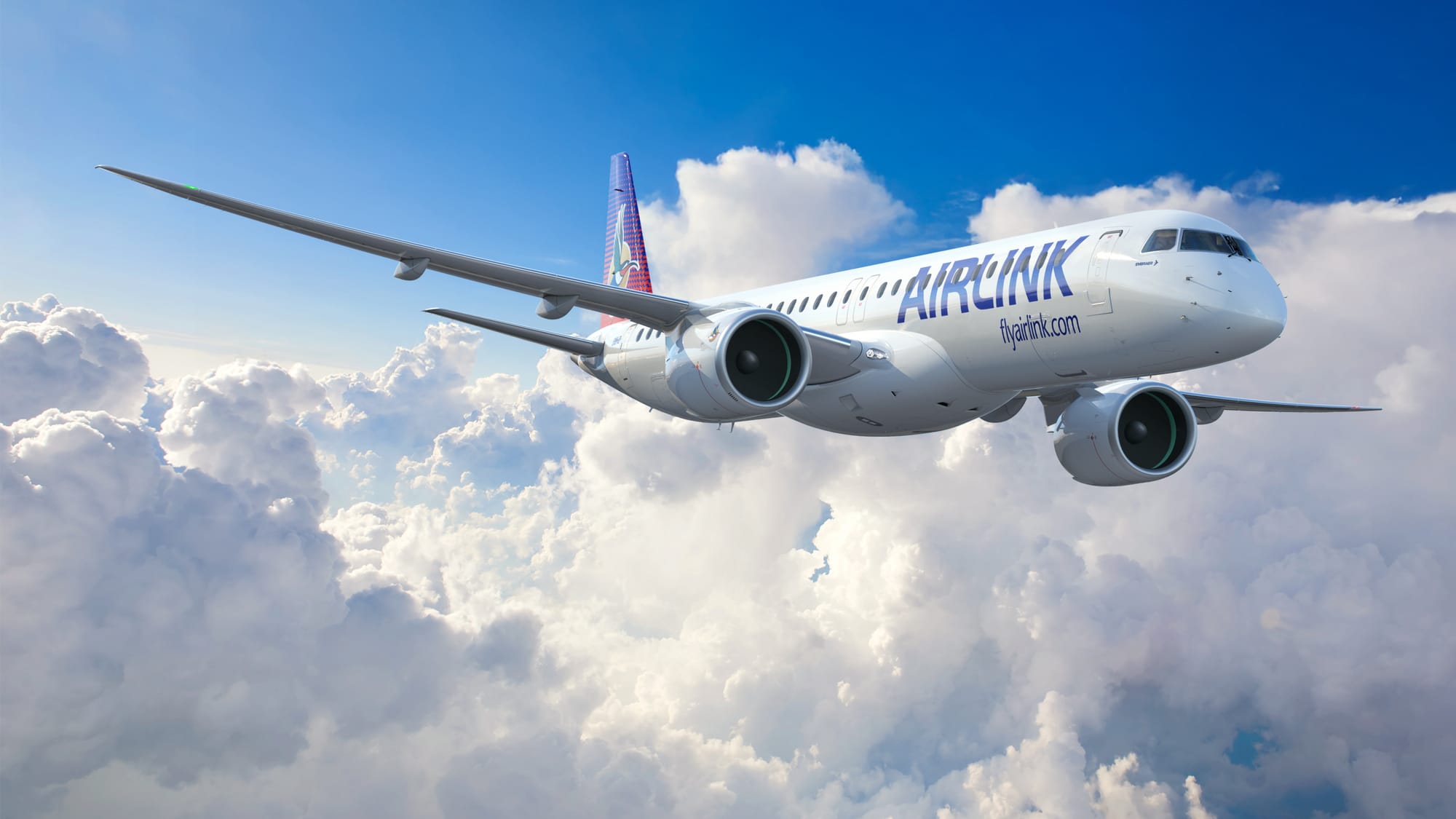 An E195-E2 in Airlink livery flying through the sky.