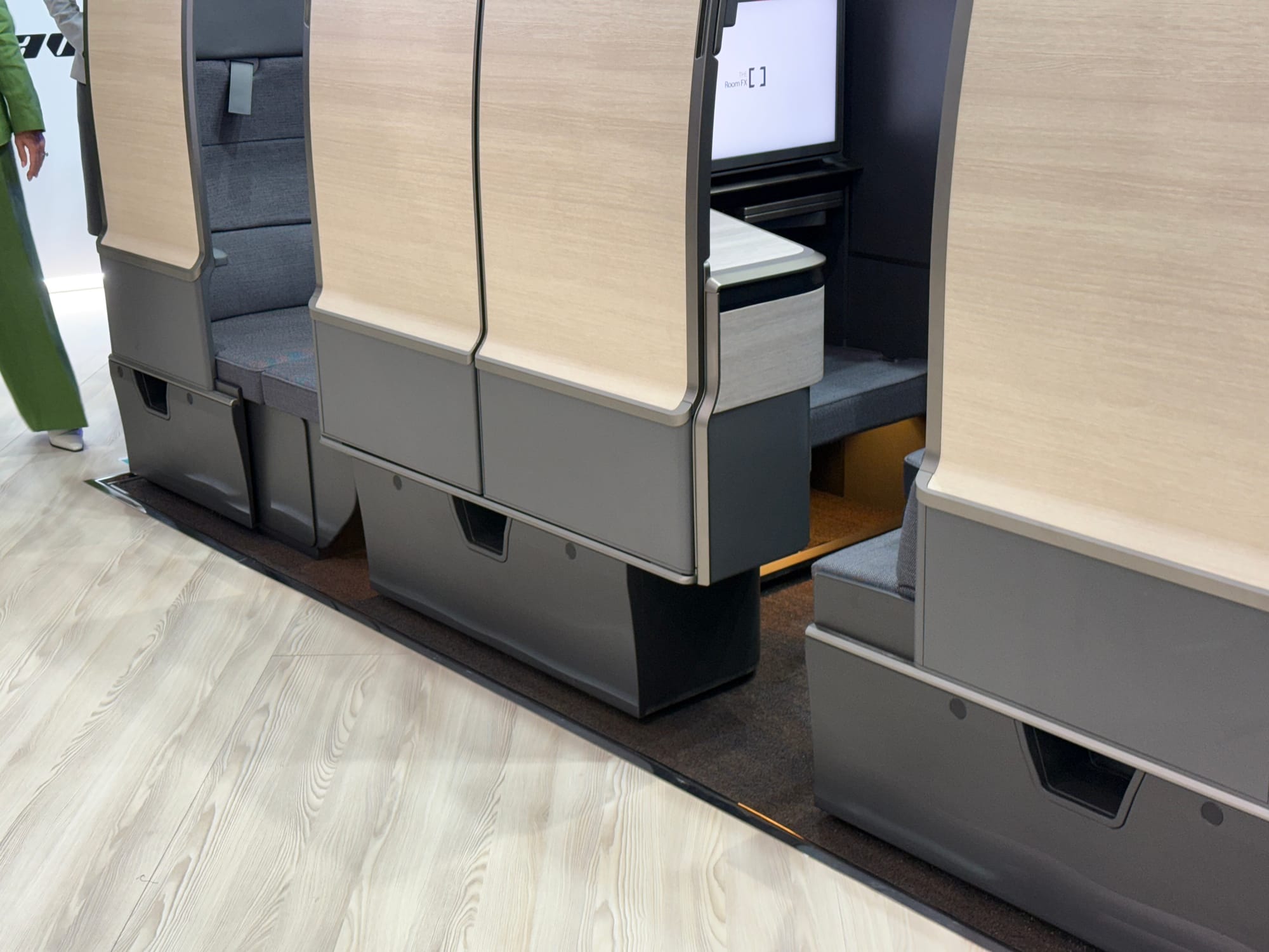 Closeup on lower area of seats, with small cutouts for steps neatly built into the pedestal of the seat structure.