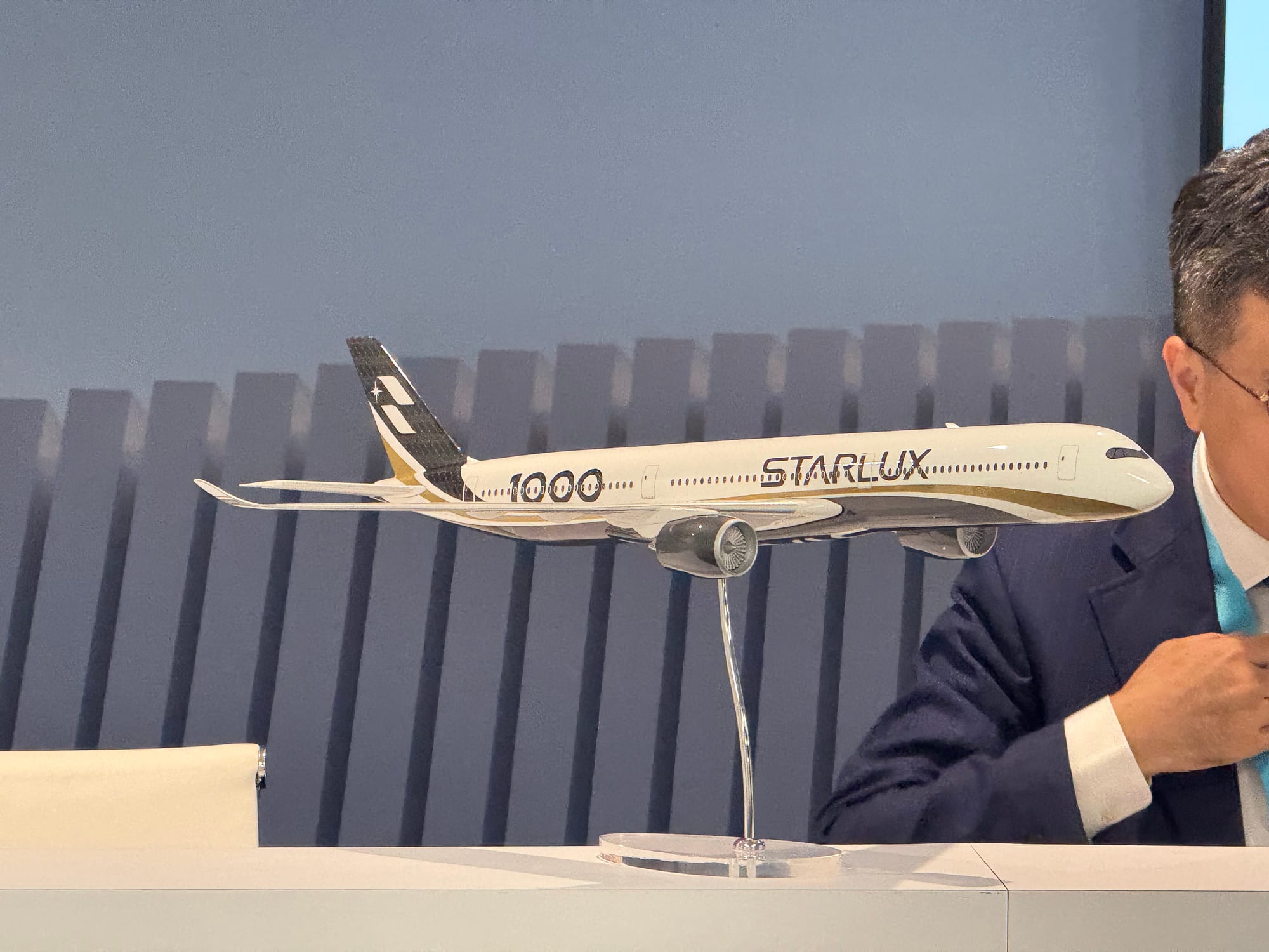 A Starlux A350-1000 model on a desk, with updated livery.