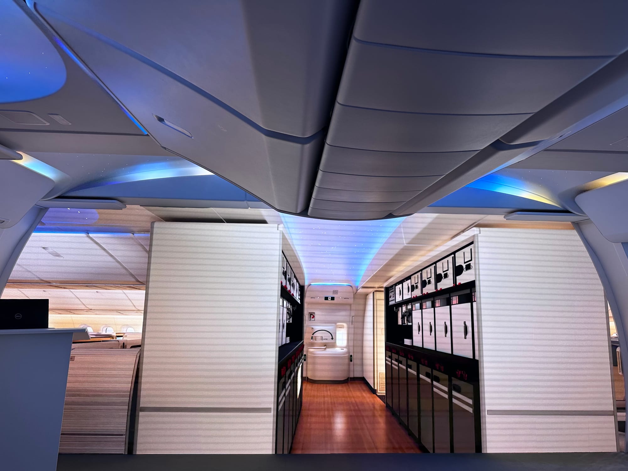 Boeing 777X mockup, showing a doors 2 galley with two different equal sections, but not centred on the doors, although with a higher ceiling.