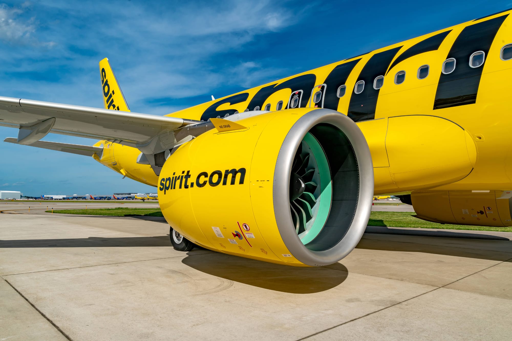 Yellow Spririt A320neo family aircraft on the ground, closeup on the engine.