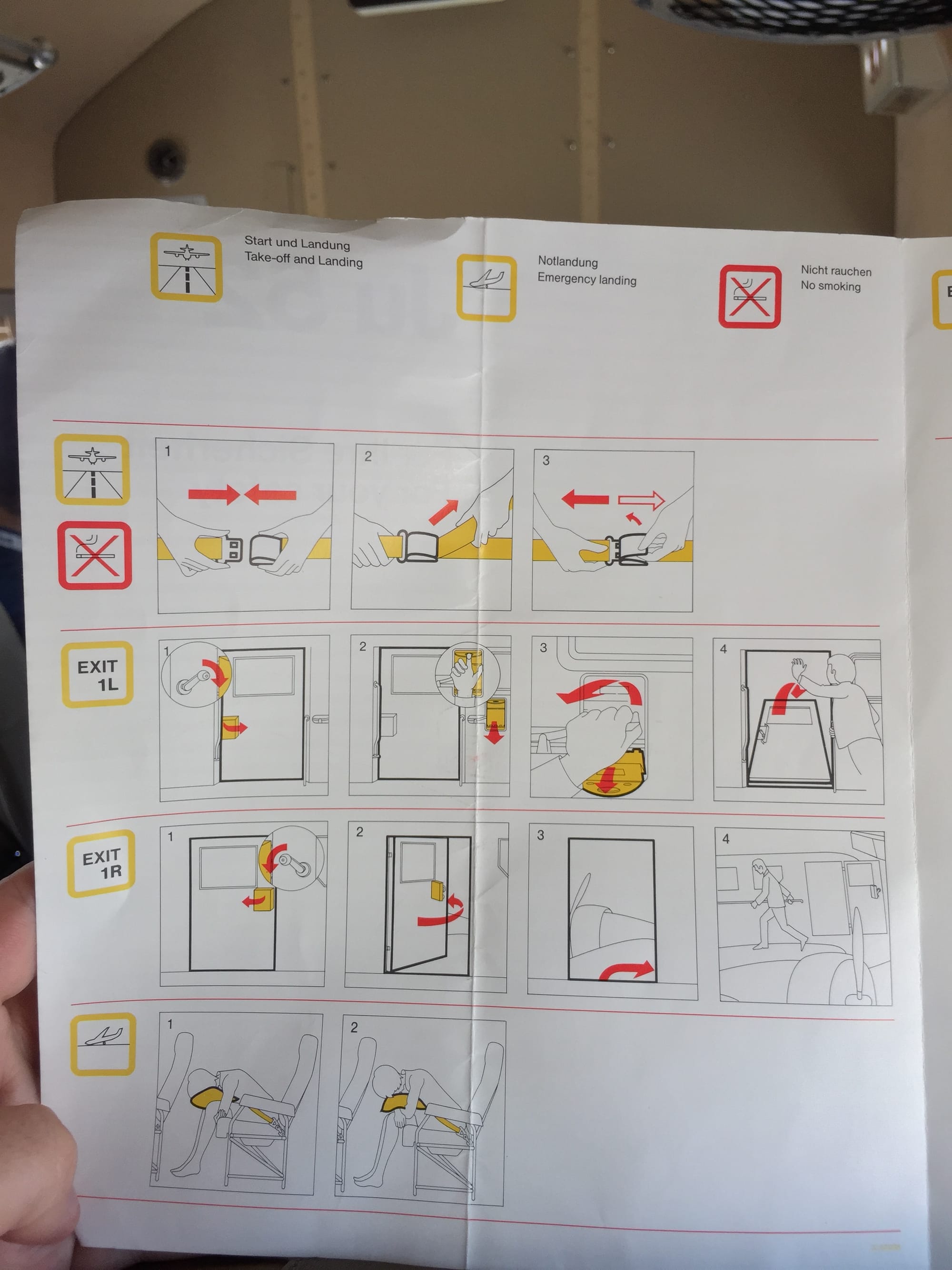 Inside the safety card, with very modern standard safety line drawings.