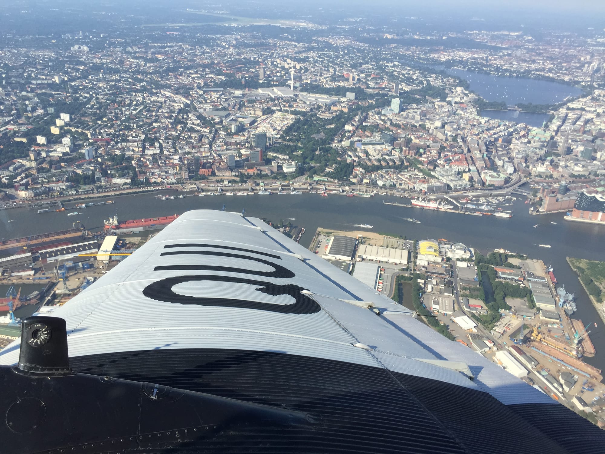 Banking shot over the right wing with the Elbe immediately above, the Alster lakes on the right and the Hamburg Messe beneath the TV tower top centre.