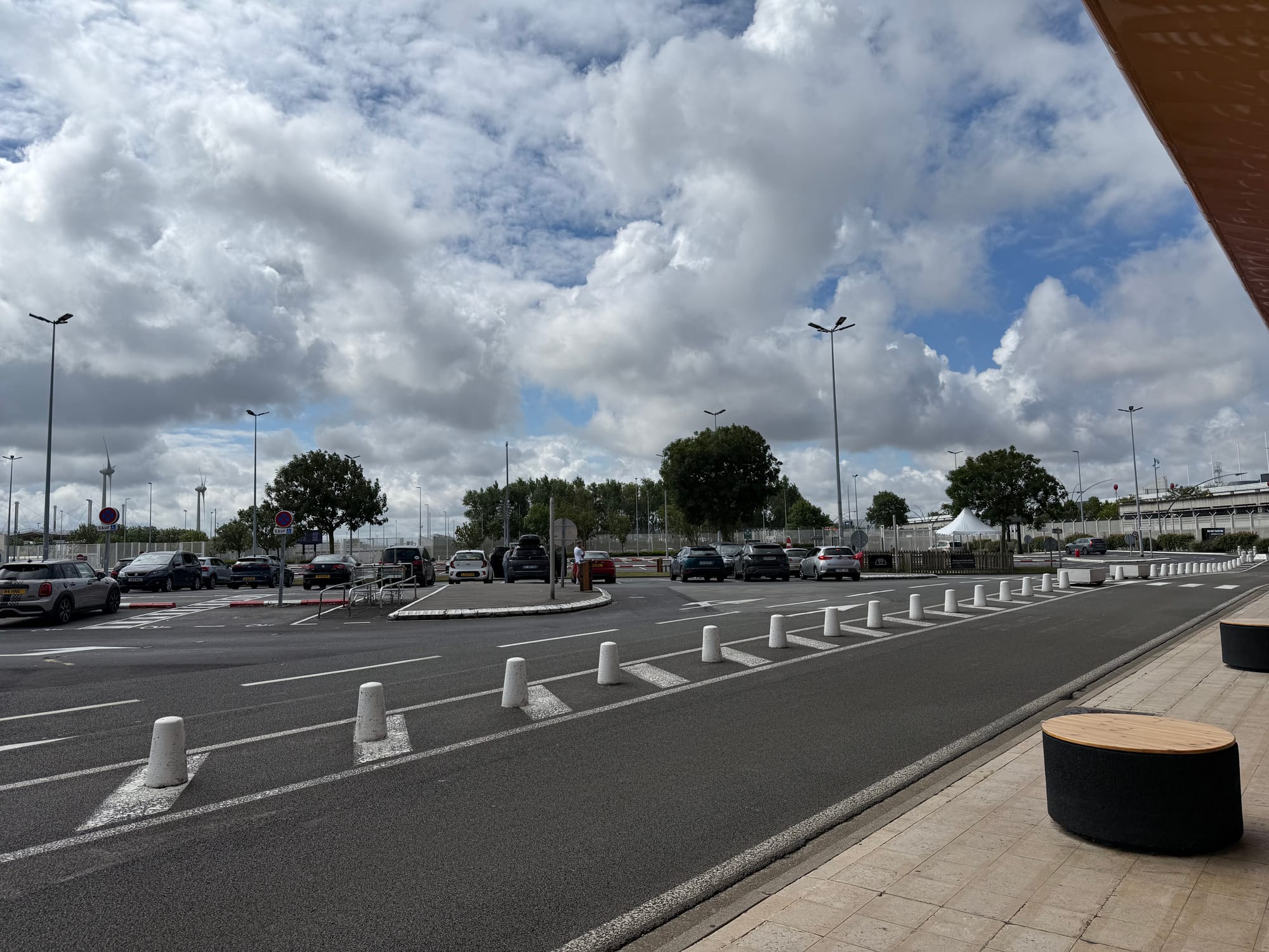 Exterior, car park with one-way system and bollards.
