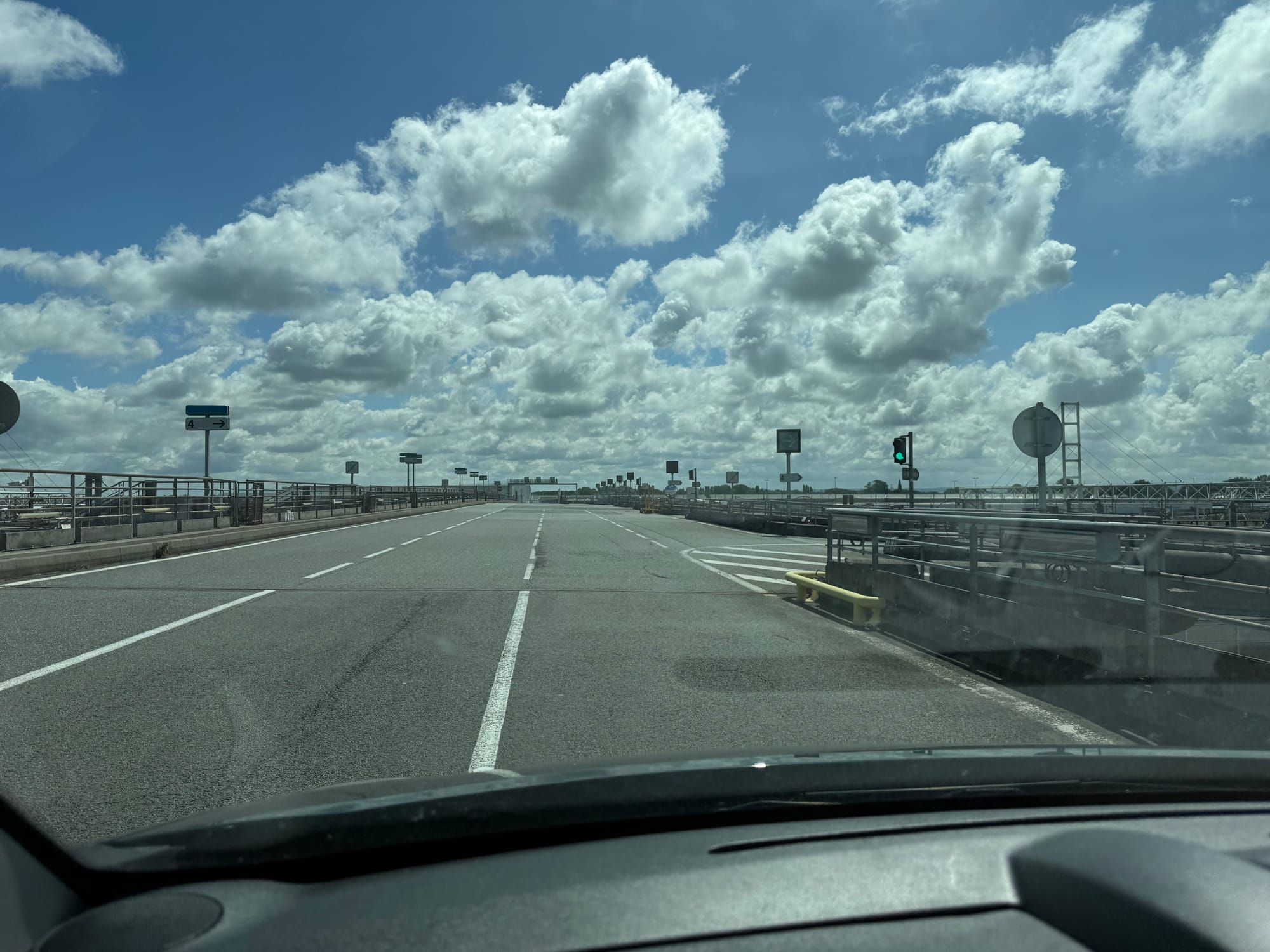 A 3-lane overpass bridge, with a half-dozen or so ramps descending on the right.