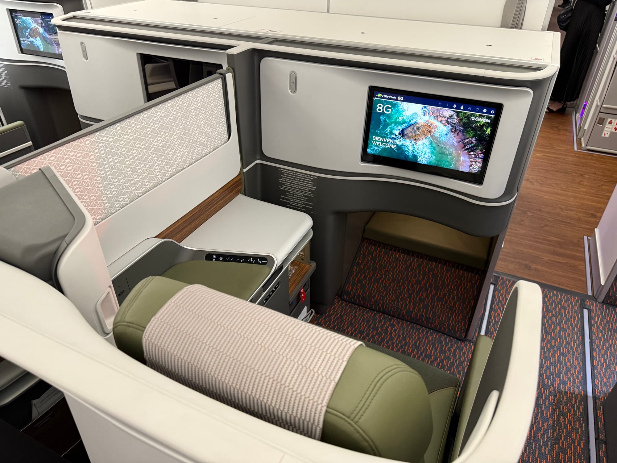 First right-hand centre seat in the second business cabin (8G), with the footrest tucking into a monument.
