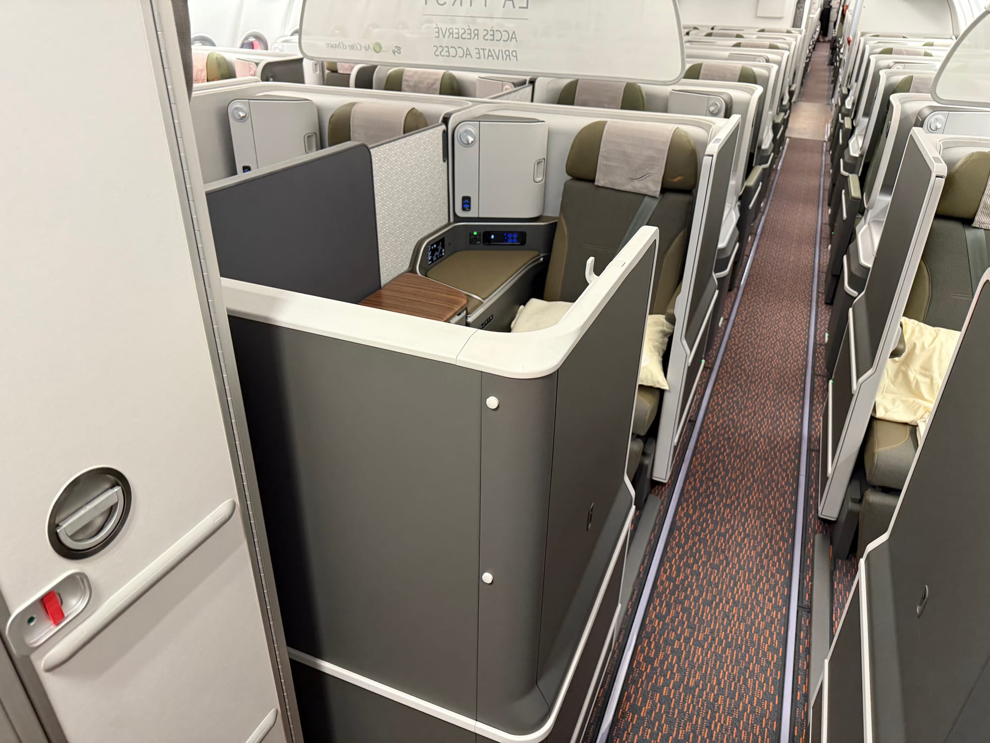 Interior aircraft, looking backwards to studio class first and business beyond, with flexible divider.