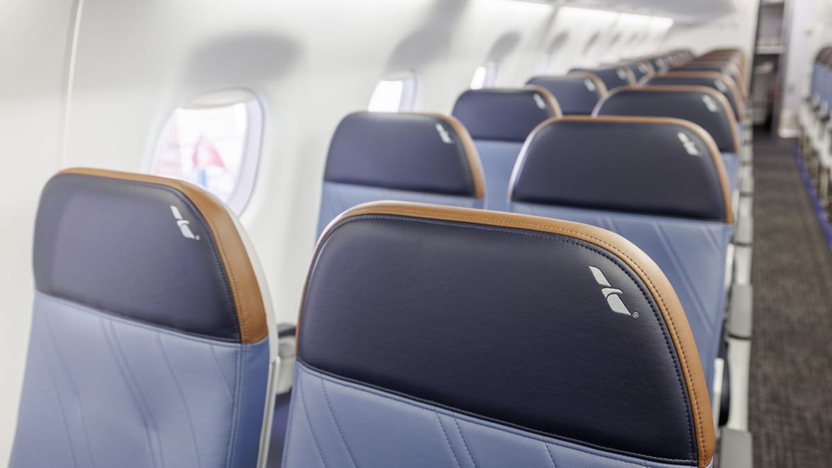 Closeup on the blue headrests, which have a streak of brown around the top and sides.