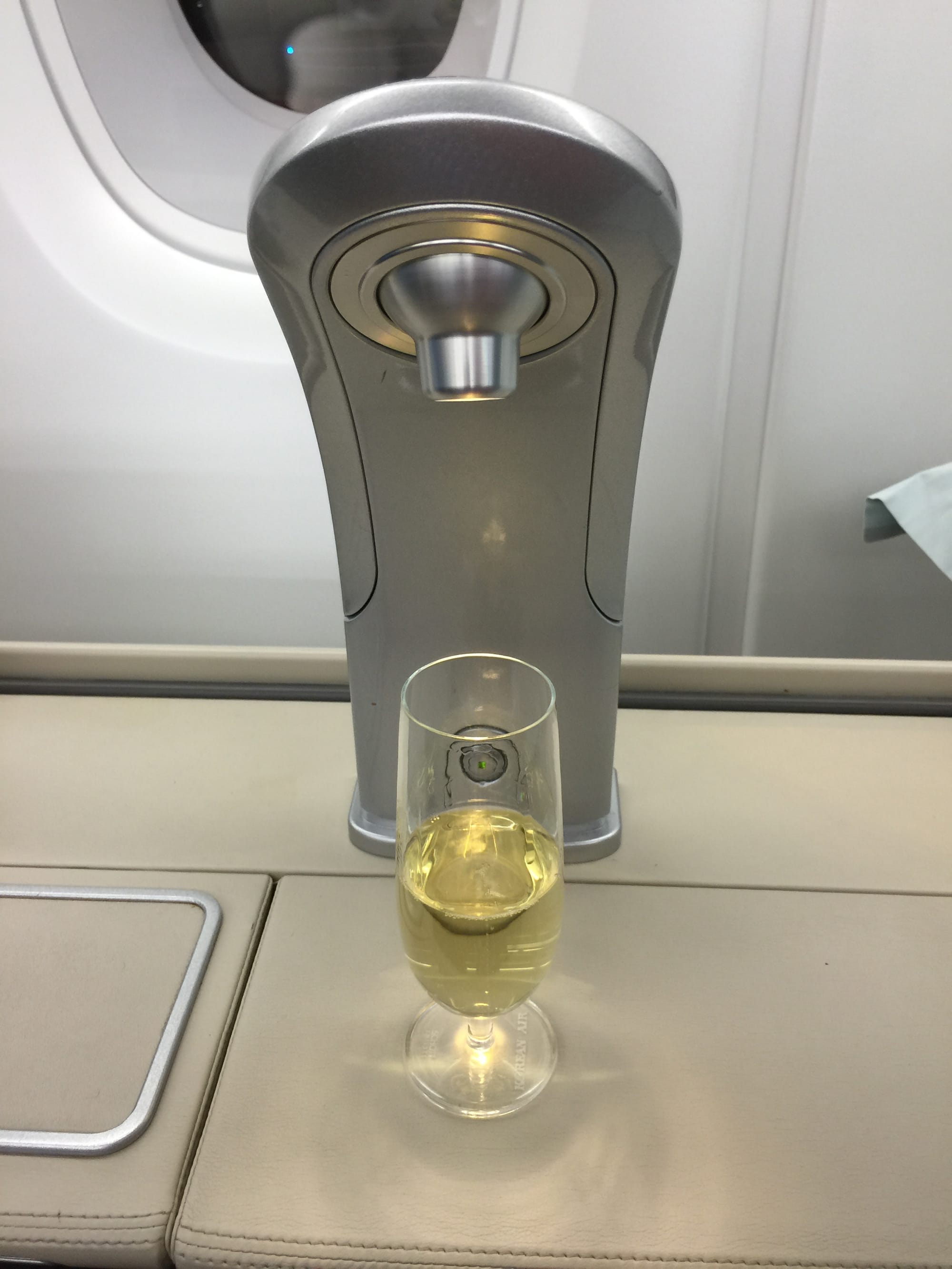 A silvery apparatus and a glass of Champagne.