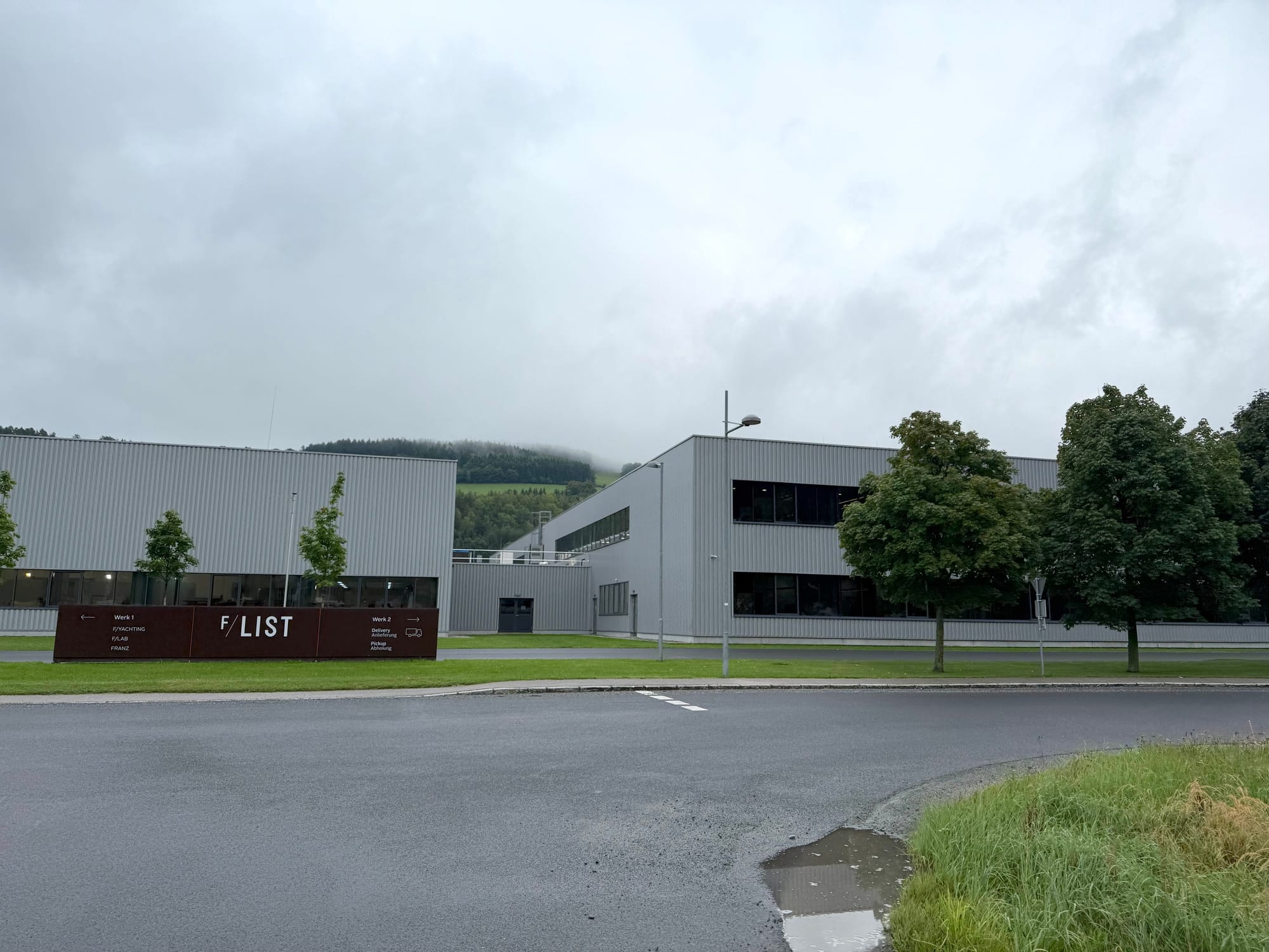Exterior photo of 2-storey light industrial buildings, with the F/LIST sign outside.