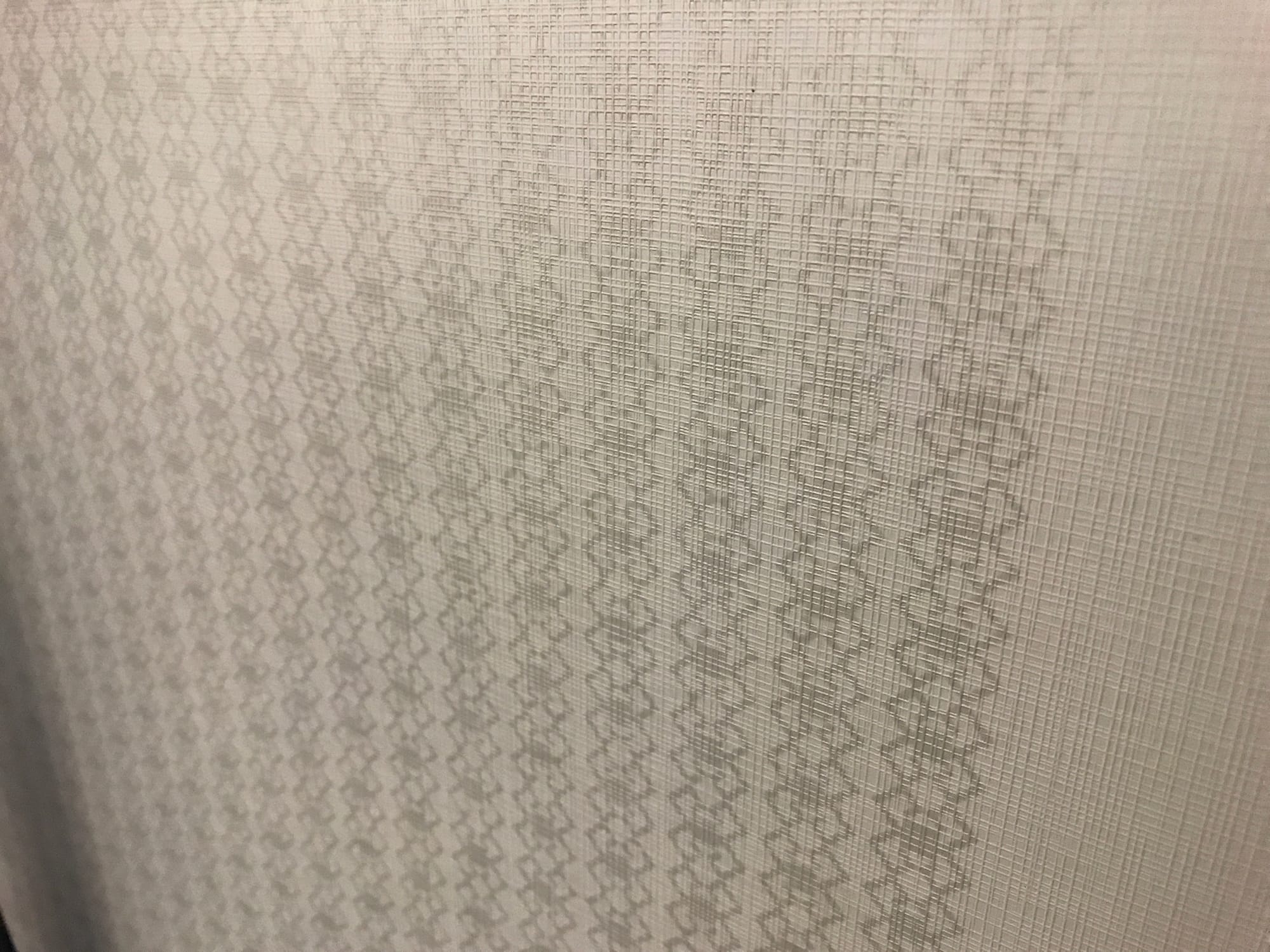 Closeup on the barong motif, which is a series of diamond/cross-like patterns in vertical columns.