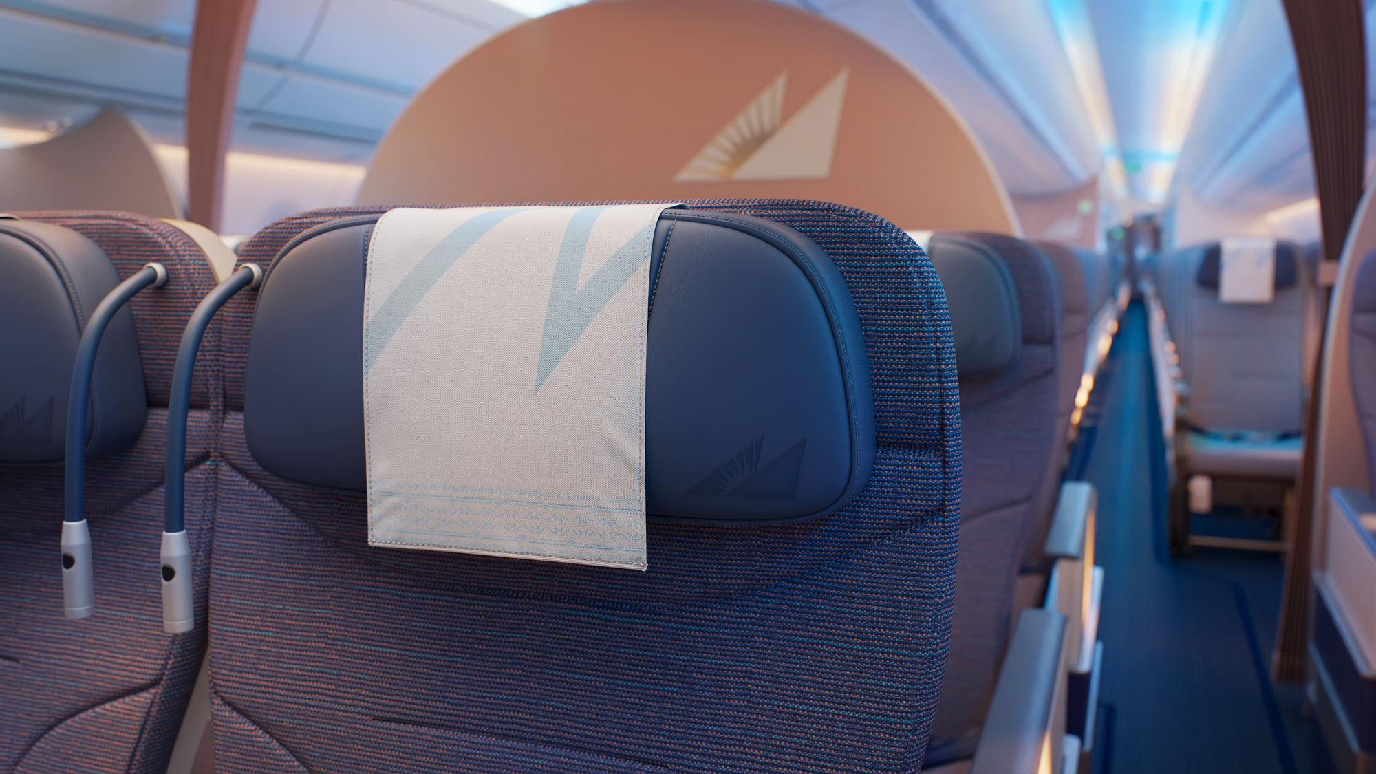 Closeup on the blue premium economy recliners, with the peach-bronze circular divider and economy beyond.