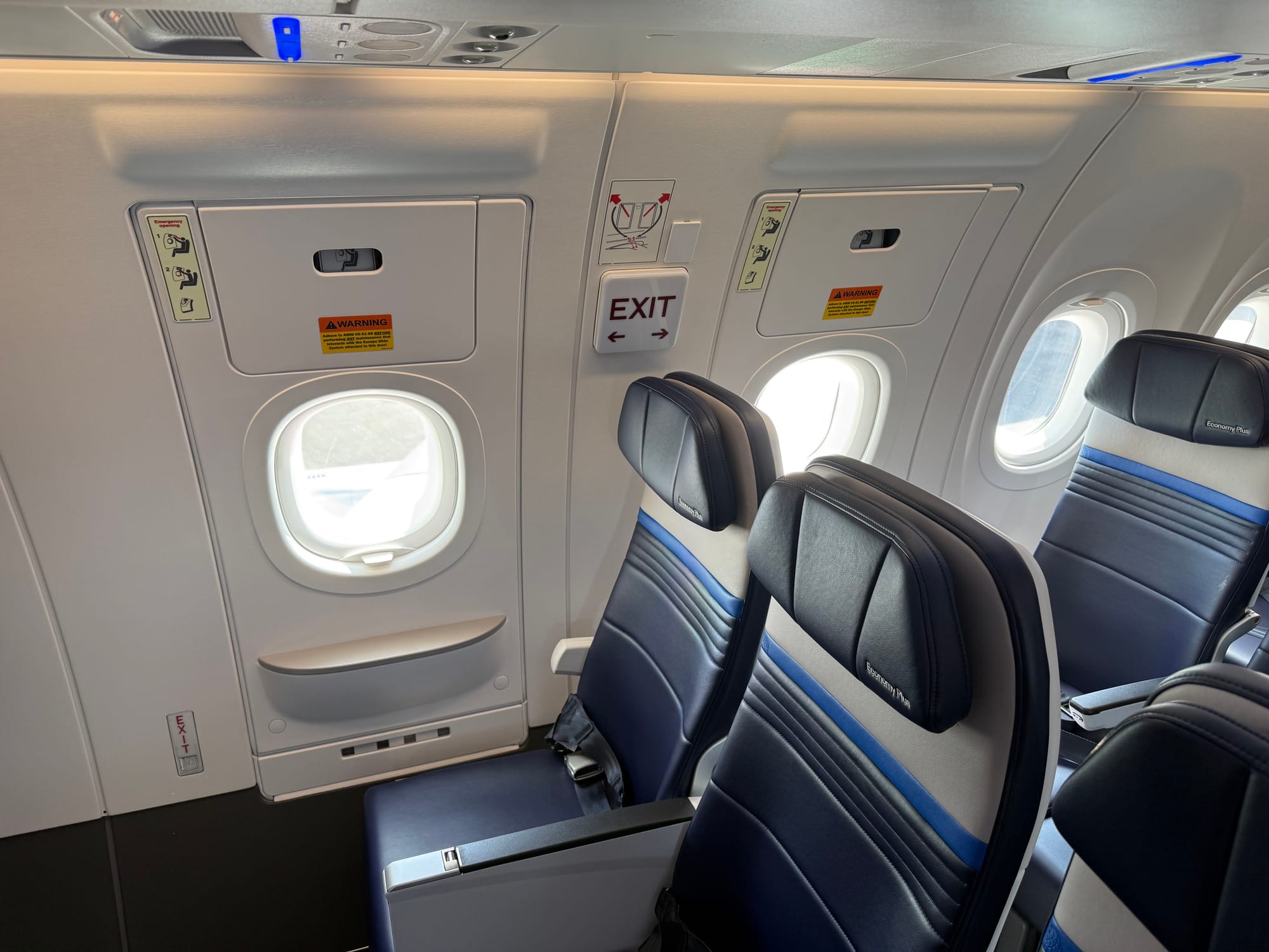 Two A321neo Airbus Cabin Flex overwing exits, set as usable, next to economy seats.