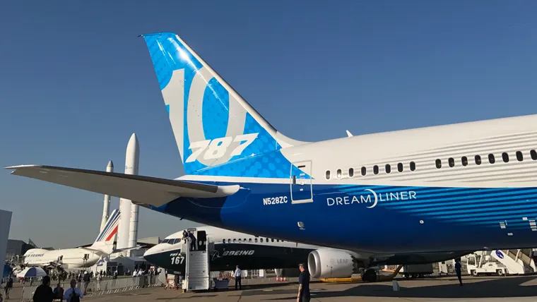 Closeup of 787-10 Dreamliner with 737 MAX behind, then the 747 and rockets of the Le Bourget air and space museum
