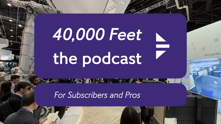 A photoshoot on the Safran Seats stand, with the 40,000 Feet podcast logo on top.