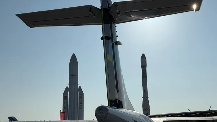 Morning shot of Le Bourget, with an ATR tail, rockets and the 747 tail peeking out.