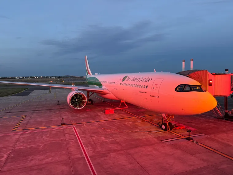 The Air Côte d’Ivoire A330neo in orange-pink light at sunset in Toulouse