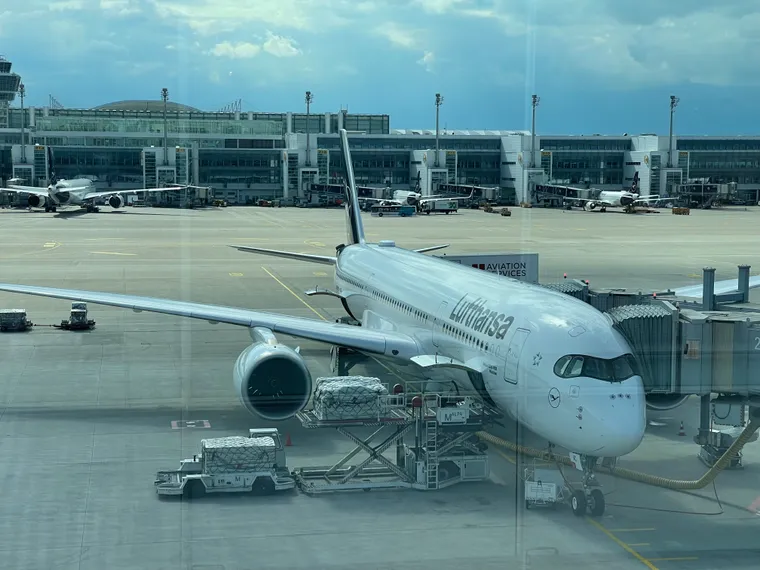 A Lufthansa A350 on the stand at Munich with other LH planes behind.