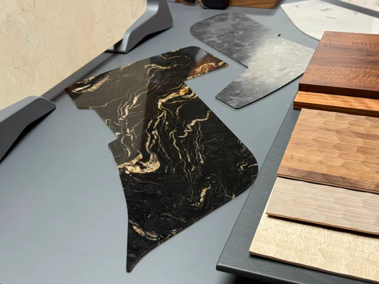 Various stone and wood design elements on a table surface.