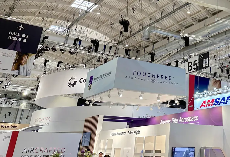 Interior, AIX hall B5, with many different stands and booths layered on top of each other