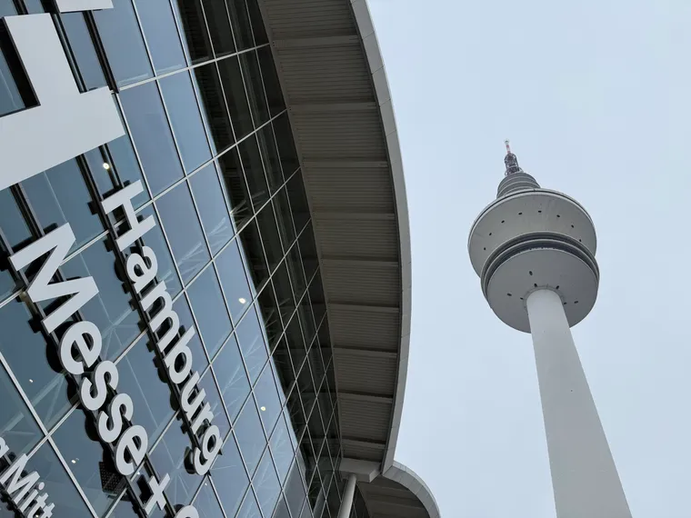 Faintly arty cloudy shot of the Hamburg Messe (with logo) and TV tower