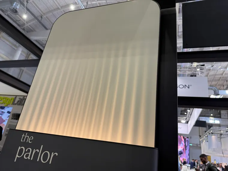 Interior trade show. A high wall marked “the parlor”, which is plastic but looks like a gently pleated sheet hanging down in white