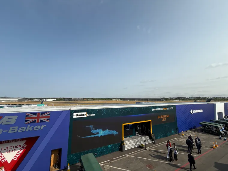 Chalet Row at Farnborough, with blue skies but almost no airlines visible.