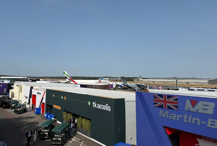 A very sparse Chalet Row and static display at Farnborough, with an A400M, Emirates A350-900, and mostly hidden United A321XLR visible